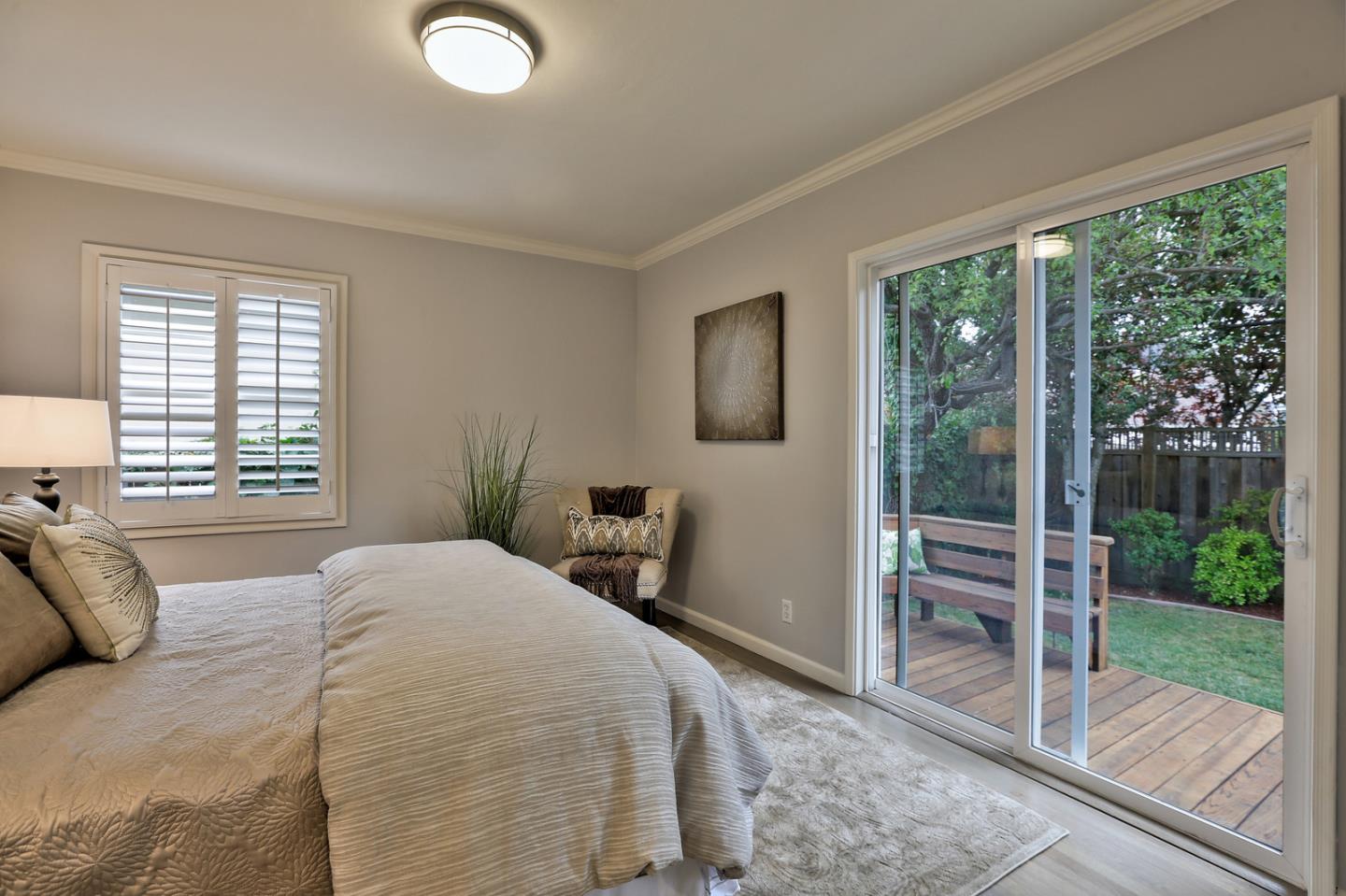 525 Alhambra Road San Mateo, CA 94402 - Photo 15 of 39 a bedroom with a bed and a view of balcony