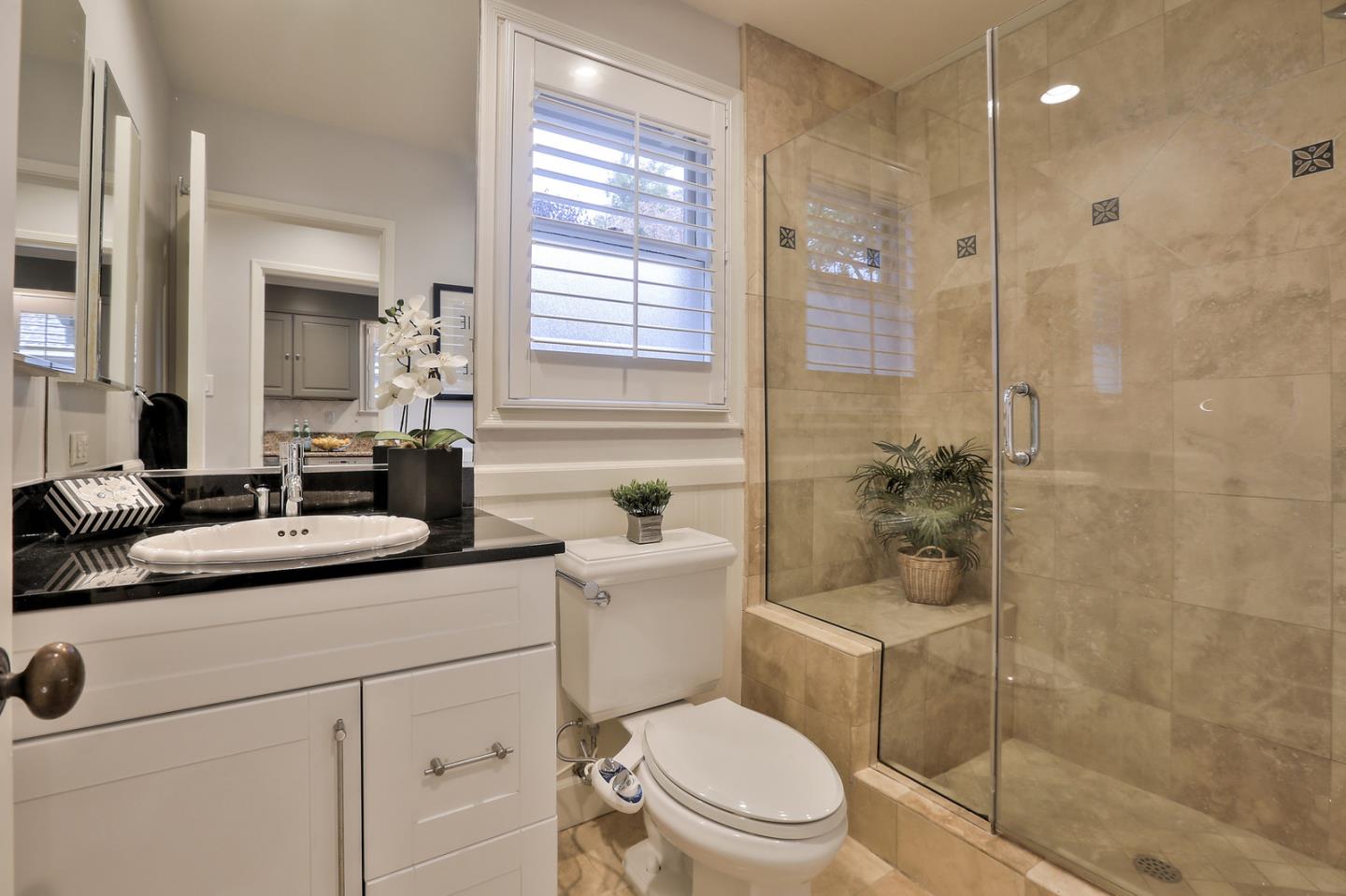 525 Alhambra Road San Mateo, CA 94402 - Photo 16 of 39 a bathroom with a sink toilet vanity and shower