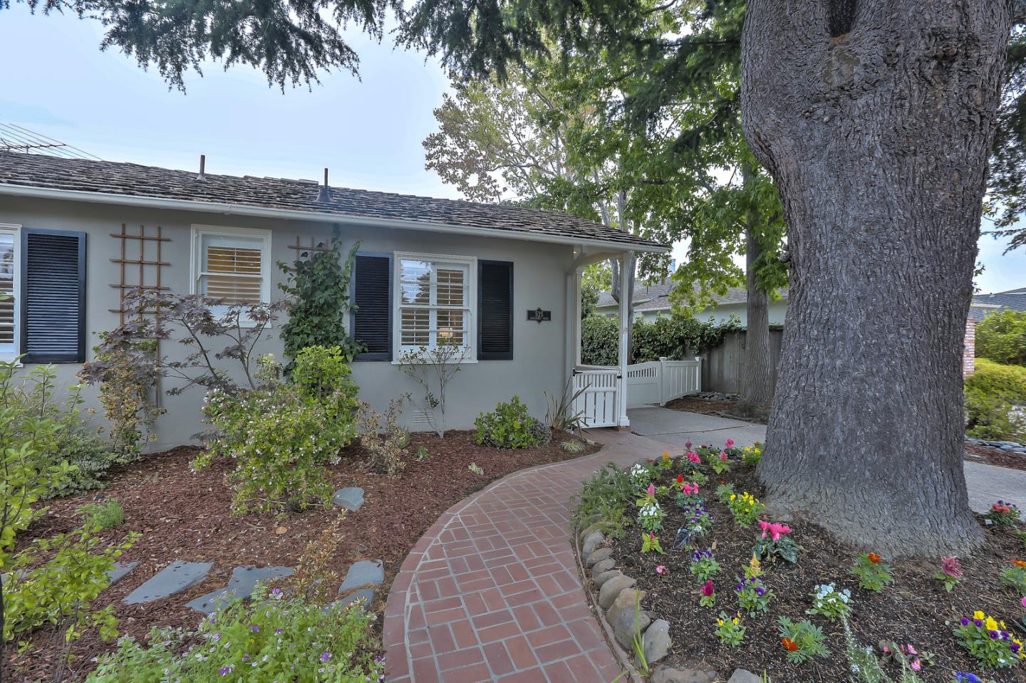 525 Alhambra Road San Mateo, CA 94402 - Photo 20 of 39 a front view of a house with a garden