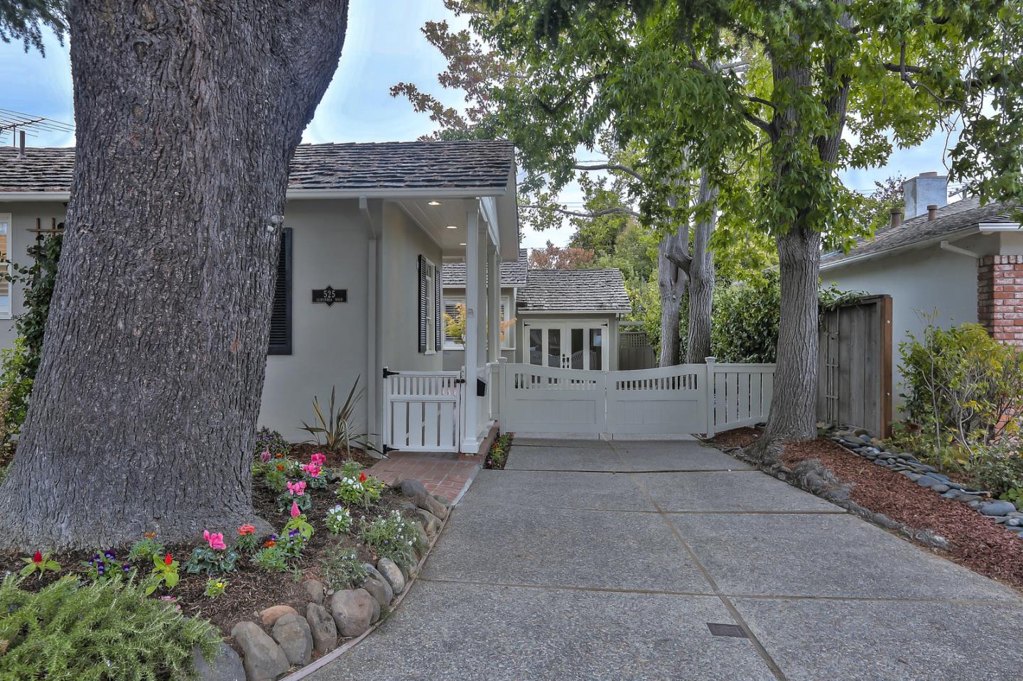 525 Alhambra Road San Mateo, CA 94402 - Photo 2 of 39 a view of a house with a flower garden