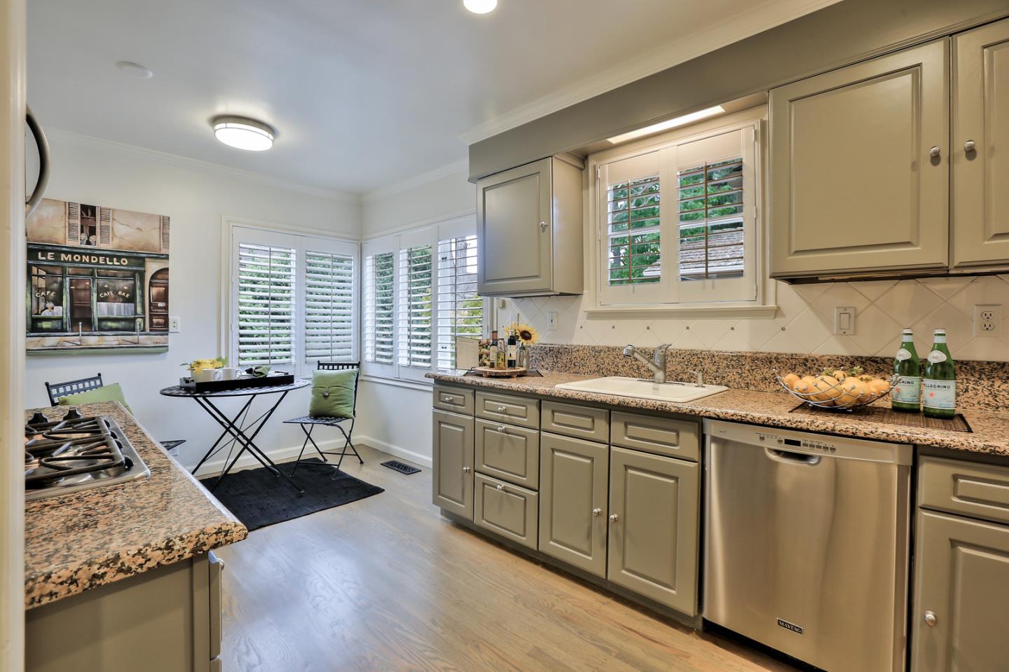 525 Alhambra Road San Mateo, CA 94402 - Photo 29 of 39 a kitchen with stainless steel appliances granite countertop a stove a sink and a microwave