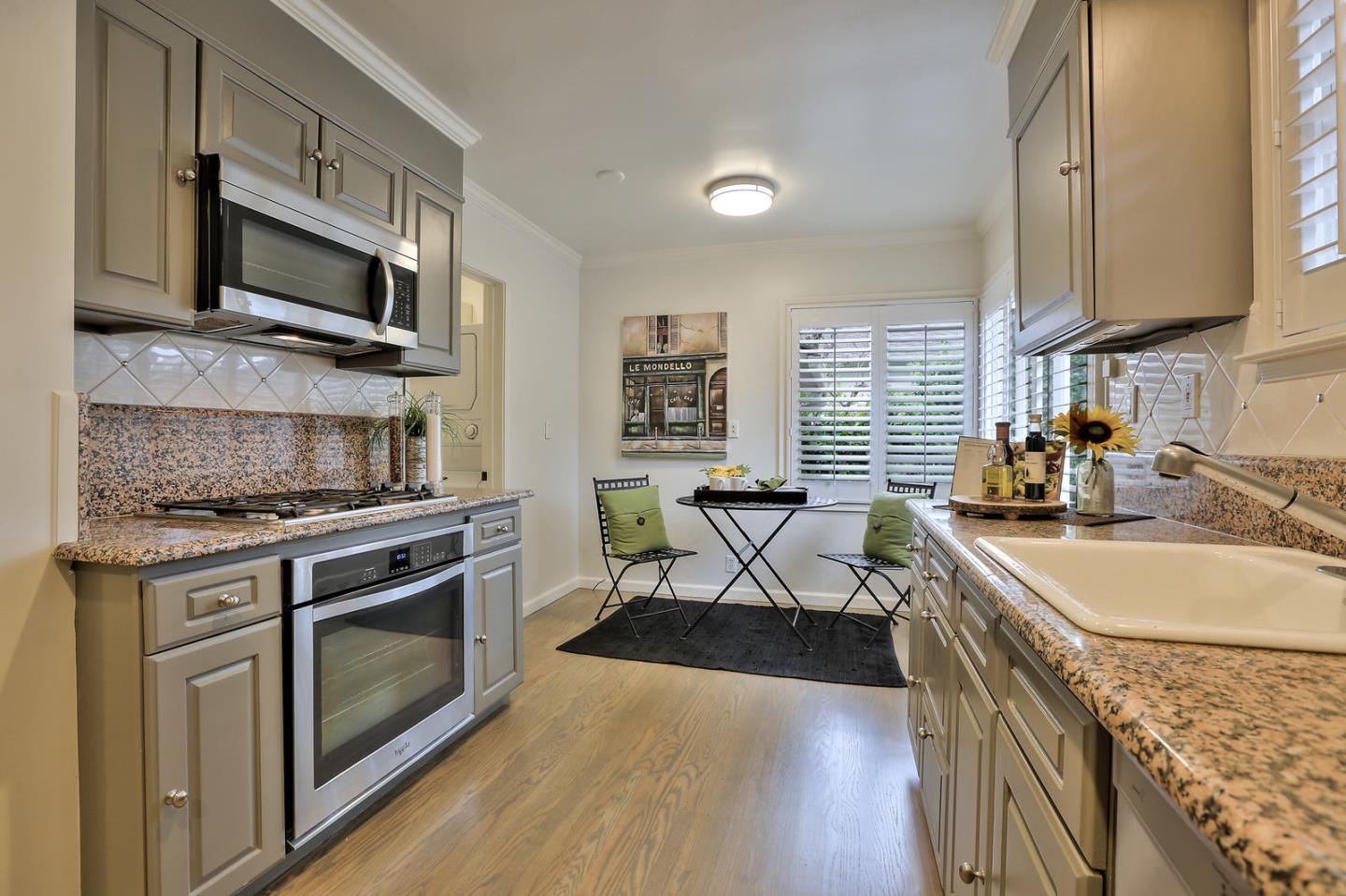 525 Alhambra Road San Mateo, CA 94402 - Photo 30 of 39 a kitchen with stainless steel appliances granite countertop a stove a sink and a microwave