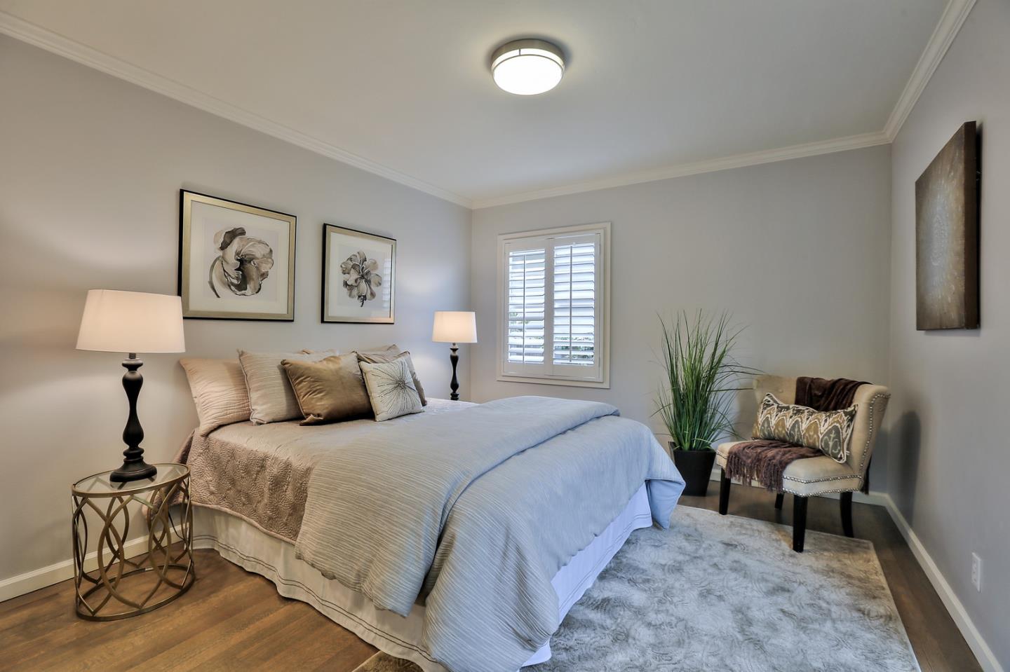 525 Alhambra Road San Mateo, CA 94402 - Photo 34 of 39 a bedroom with a bed and a lamp