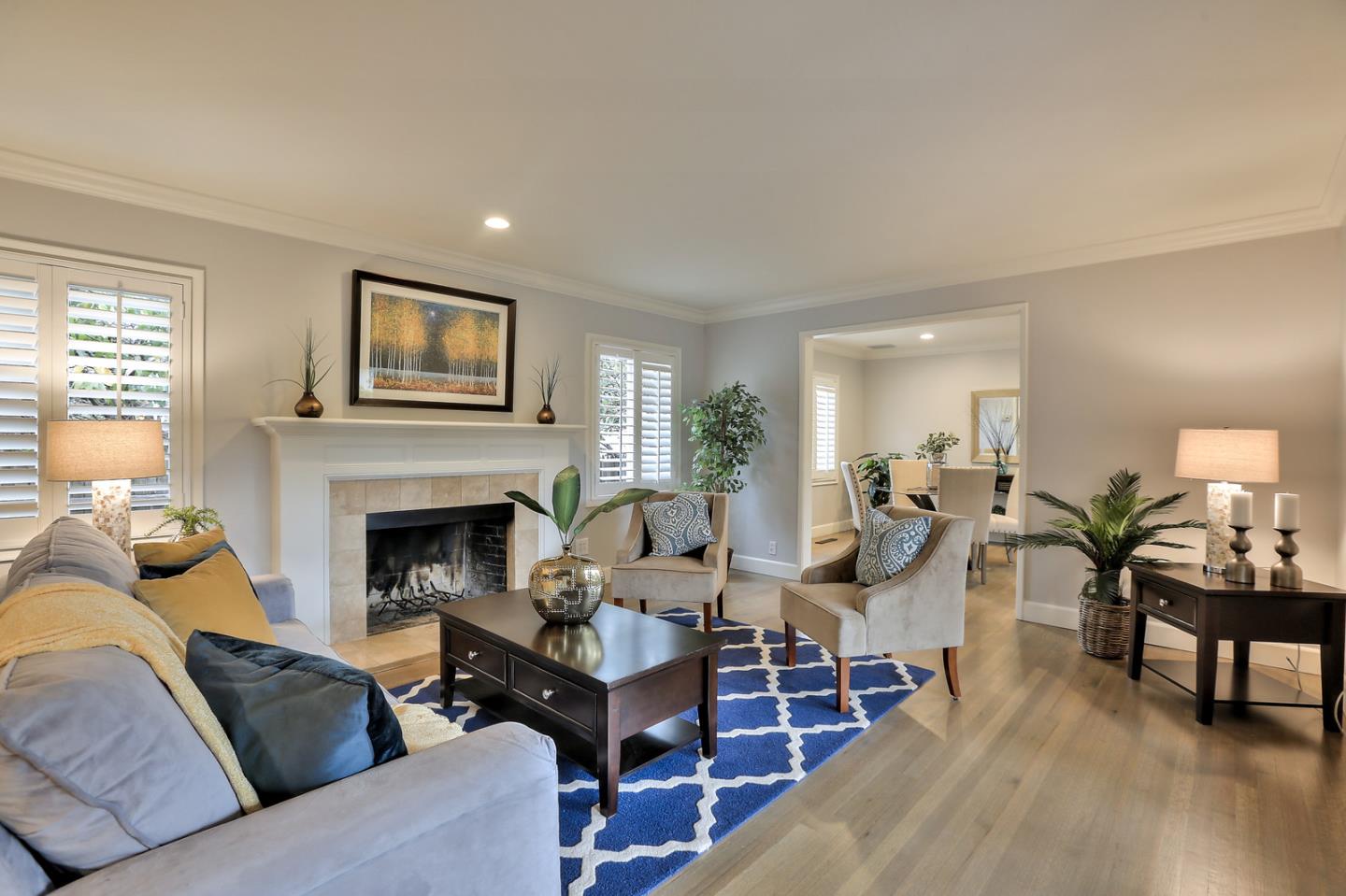 525 Alhambra Road San Mateo, CA 94402 - Photo 5 of 39 a living room with furniture and a fireplace