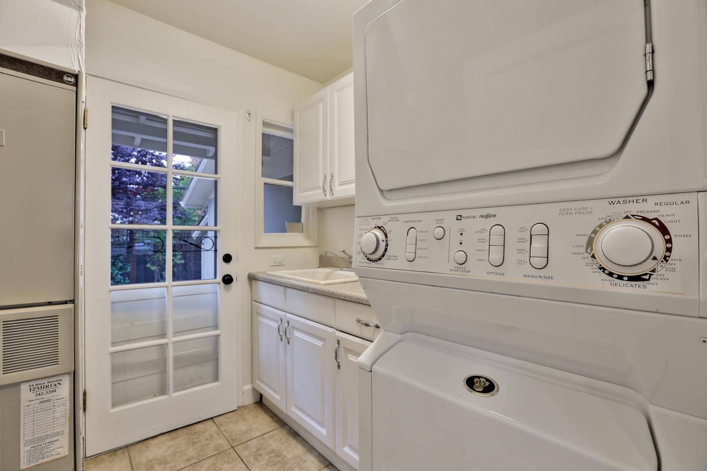 525 Alhambra Road San Mateo, CA 94402 - Photo 9 of 39 a bathroom with a sink a vanity and a shower
