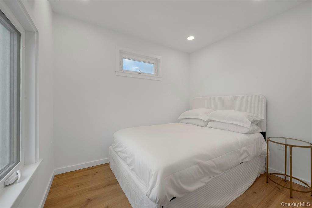 150 Bedford Road Armonk, NY 10504 - Photo 7 of 15 Bedroom with light wood finished floors and recessed lighting