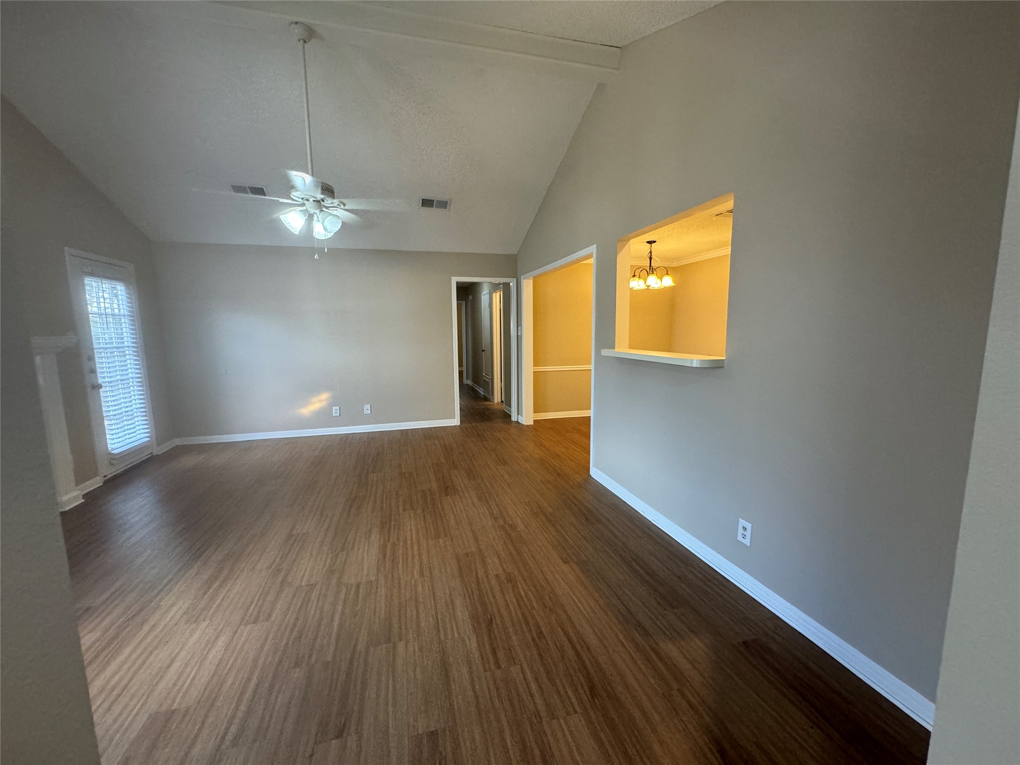 214 Tamara Drive, Unit A Georgetown, TX 78628 - Photo 8 of 34 wooden floor in an empty room with a window