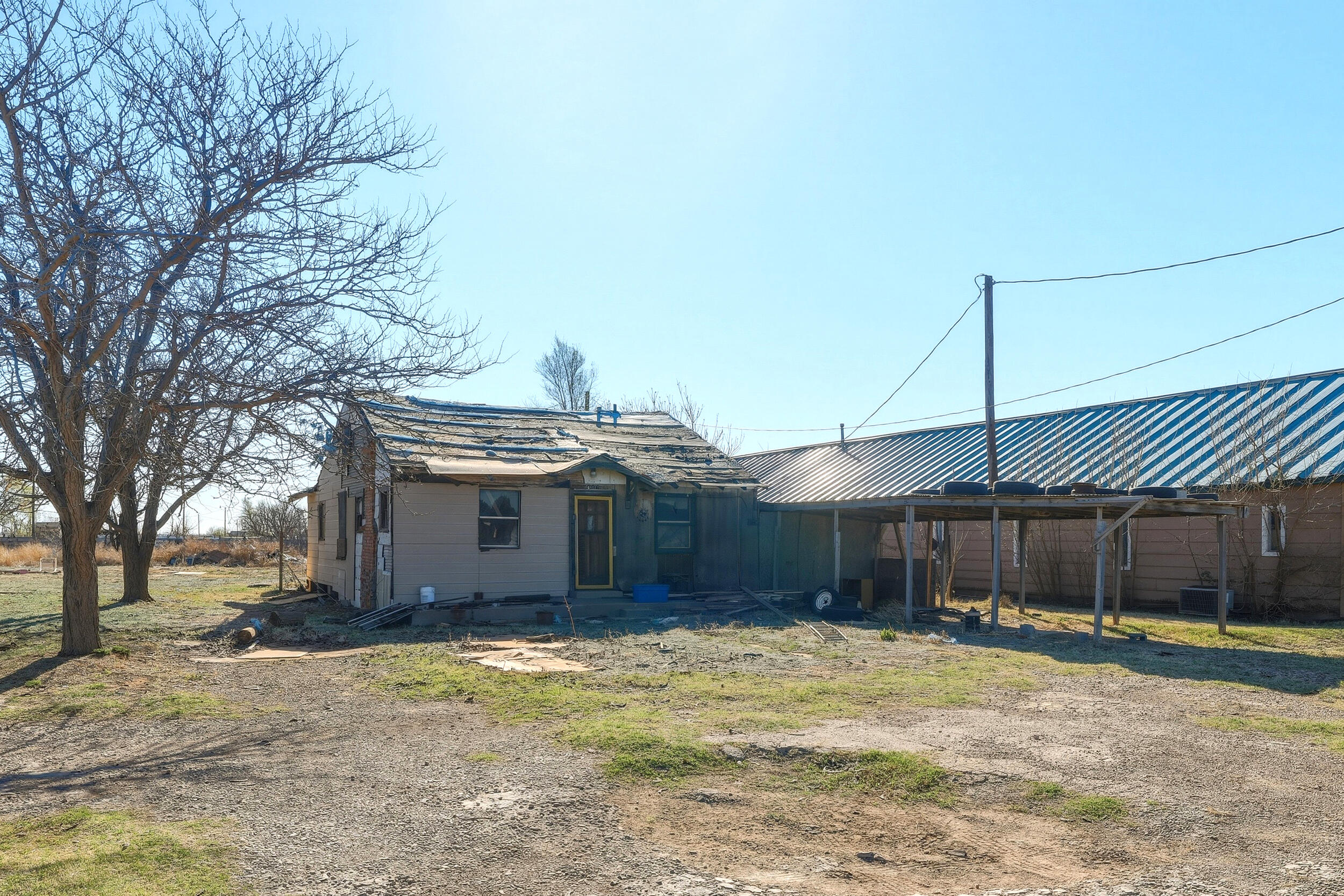 607 Inler Avenue Lubbock, TX 79416 - Photo 3 of 13 a front view of a house with a yard and garage