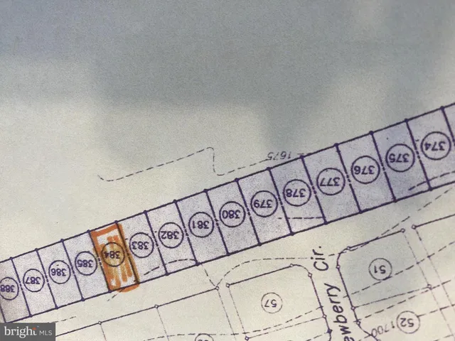 a view of staircase with railing and a window