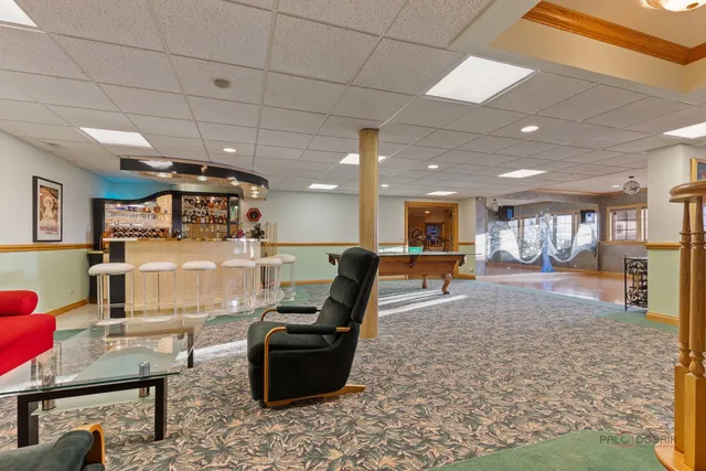 a large room with a lots of furniture and a chandelier