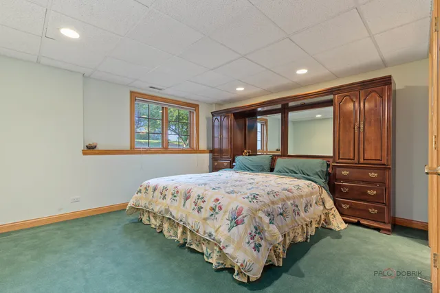 a kitchen with granite countertop white cabinets white appliances with a sink and dishwasher