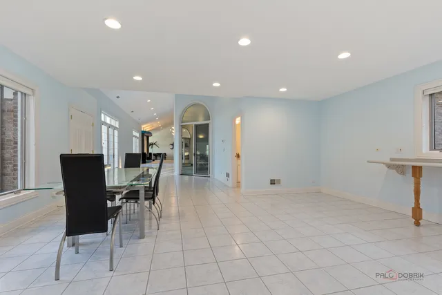 a living room with fireplace furniture and a wooden floor