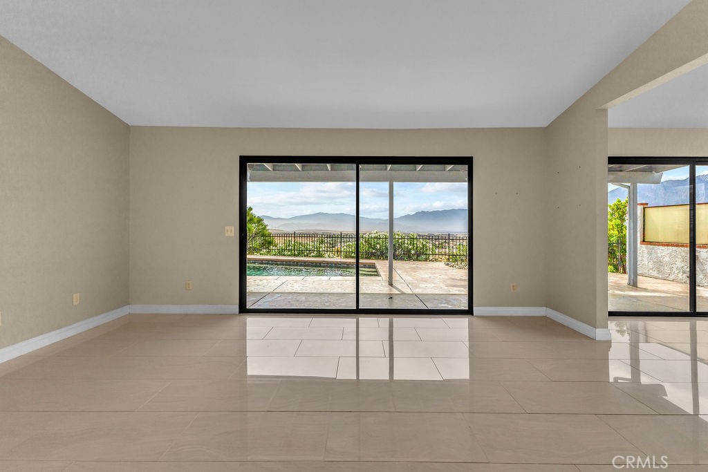 67525 Monterey Road Desert Hot Springs, CA 92240 - Photo 12 of 75 a view of an empty room with a window