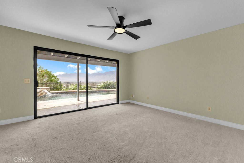 67525 Monterey Road Desert Hot Springs, CA 92240 - Photo 27 of 75 a view of an empty room with a window
