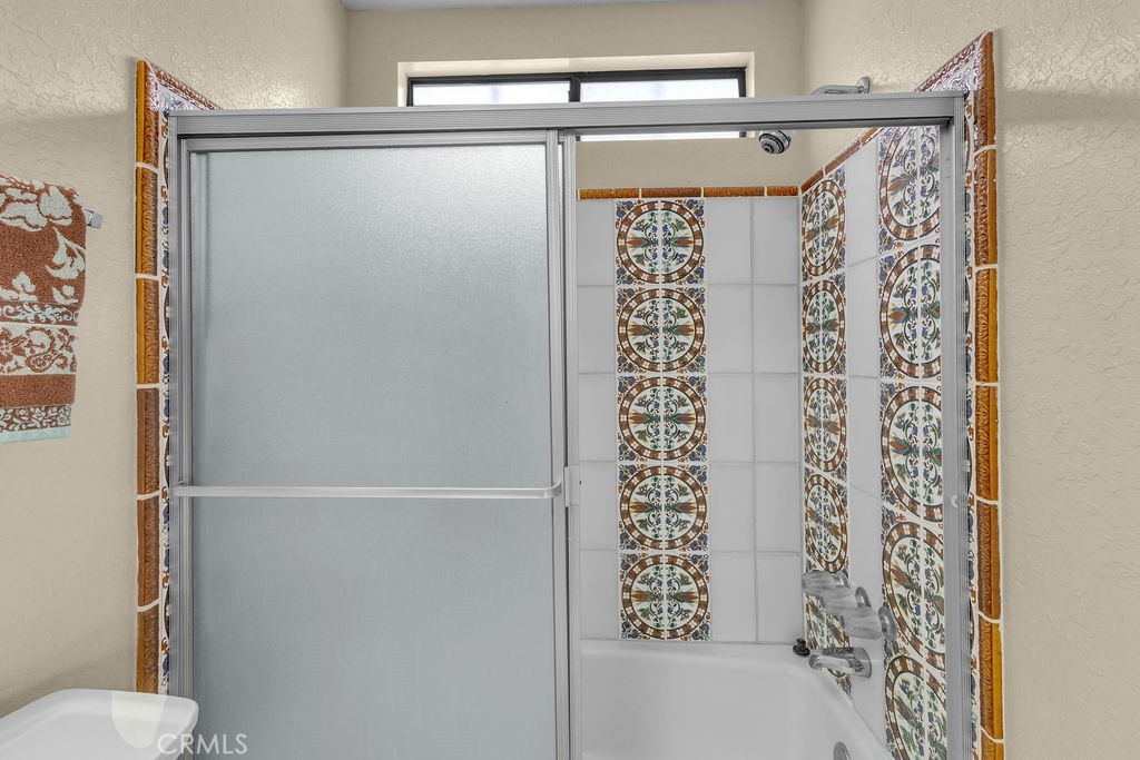 67525 Monterey Road Desert Hot Springs, CA 92240 - Photo 33 of 75 a bathroom with a shower and a toilet