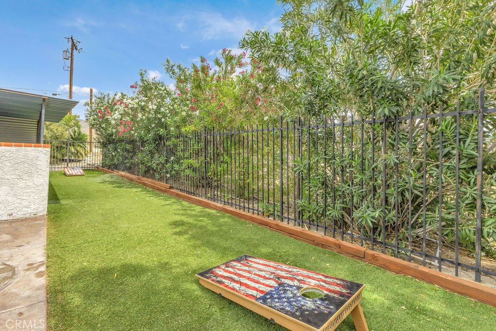 67525 Monterey Road Desert Hot Springs, CA 92240 - Photo 48 of 75 a view of a yard with a bench