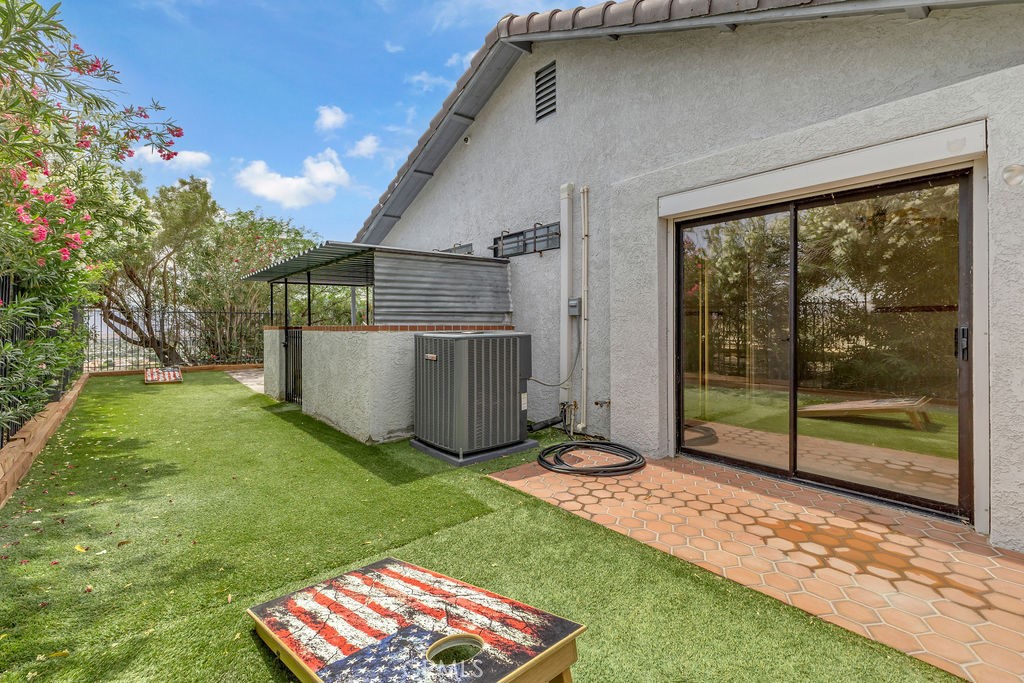 67525 Monterey Road Desert Hot Springs, CA 92240 - Photo 53 of 75 a view of a backyard with a garden and entertaining space