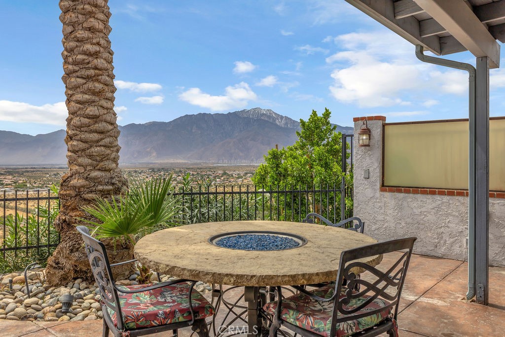 67525 Monterey Road Desert Hot Springs, CA 92240 - Photo 57 of 75 a view of a balcony with table and chairs