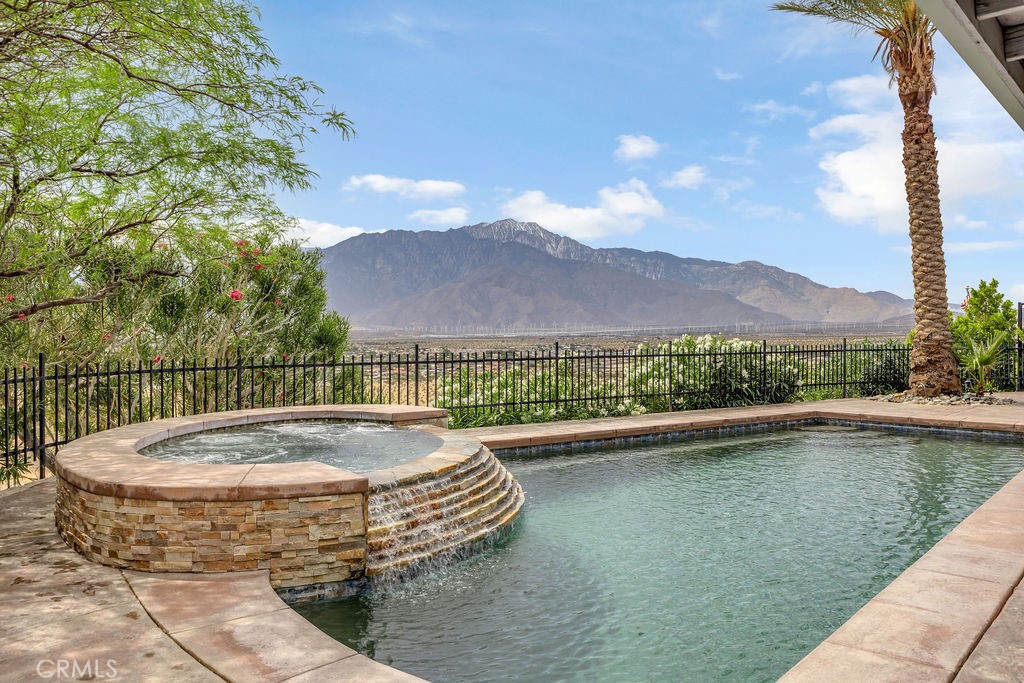 67525 Monterey Road Desert Hot Springs, CA 92240 - Photo 59 of 75 a view of a swimming pool with a terrace