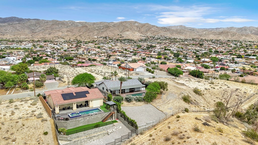 67525 Monterey Road Desert Hot Springs, CA 92240 - Photo 71 of 75 an aerial view of residential houses with outdoor space