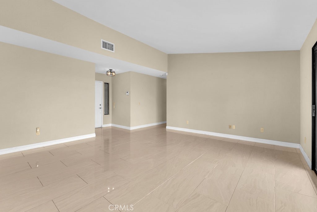 67525 Monterey Road Desert Hot Springs, CA 92240 - Photo 9 of 75 a view of an empty room with wooden floor