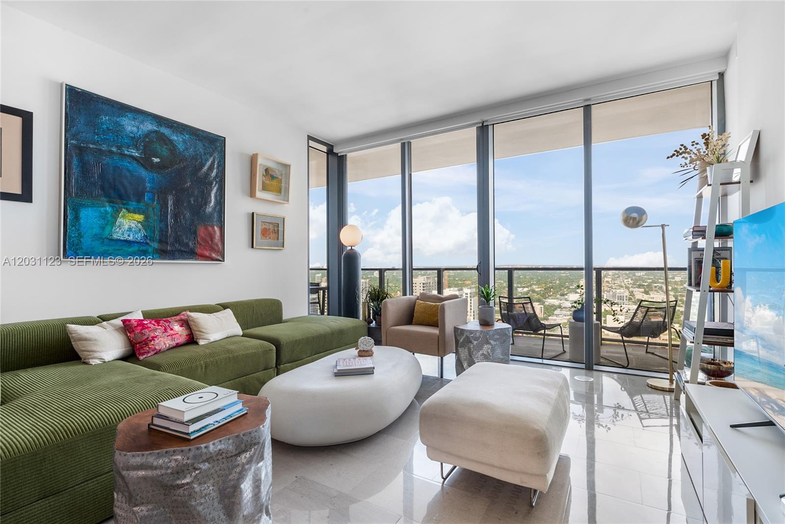 88 Southwest 7th Street, Unit 3208 Miami, FL 33130 - Photo 1 of 16 a living room with furniture and a large window
