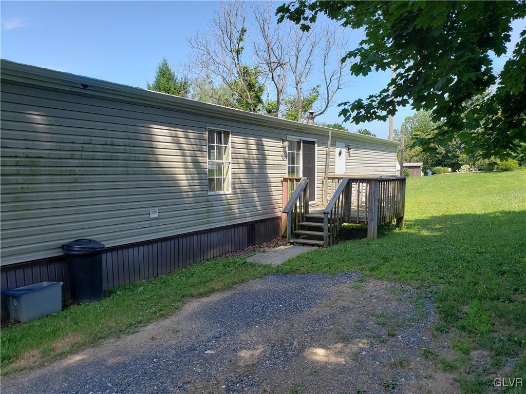 509 School Road Nazareth, PA 18064 - Photo 1 of 13 a view of a backyard with plants and large tree
