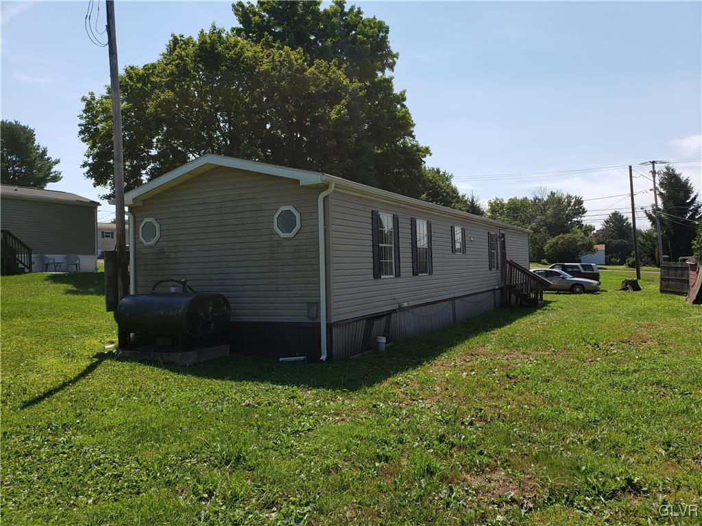 509 School Road Nazareth, PA 18064 - Photo 5 of 13 a view of backyard with potted plants and a large tree