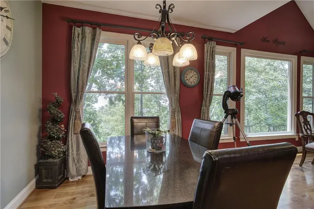 a view of a patio with a table chairs and backyard