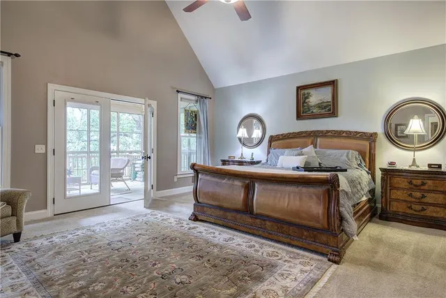 a bathroom with a granite countertop sink a toilet and a mirror