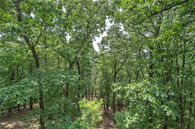 a view of outdoor space with a table and chairs under an umbrella