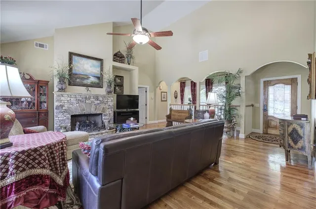 a living room with furniture and a fireplace