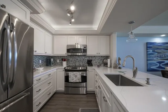 a bedroom with a large bed couch and a window