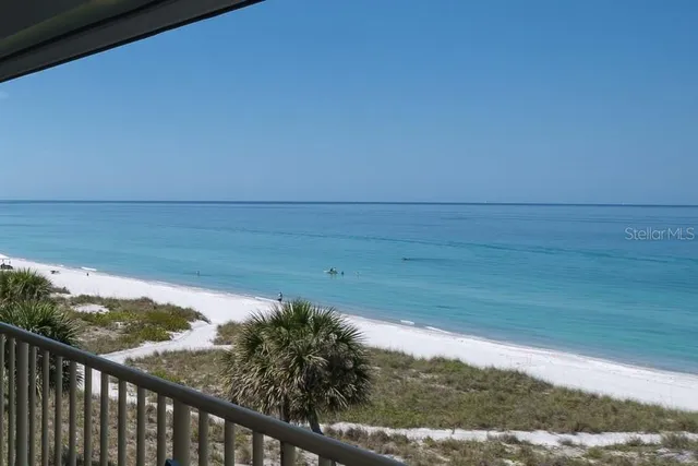 swimming pool view with a seating space