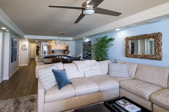 a view of swimming pool with outdoor seating and plants