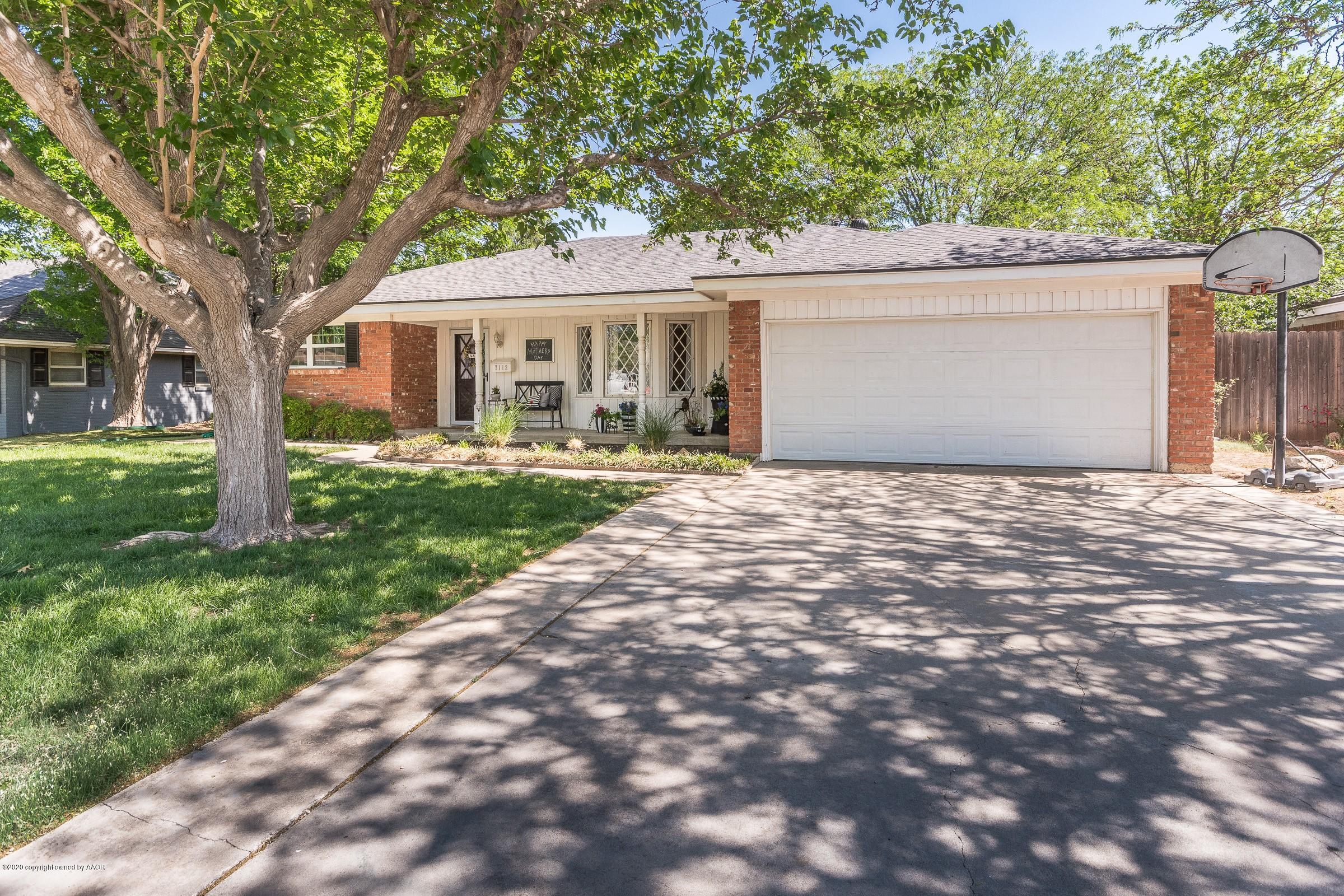7112 Calumet Road Amarillo, TX 79106 - Photo 1 of 30 a front view of house with yard and green space