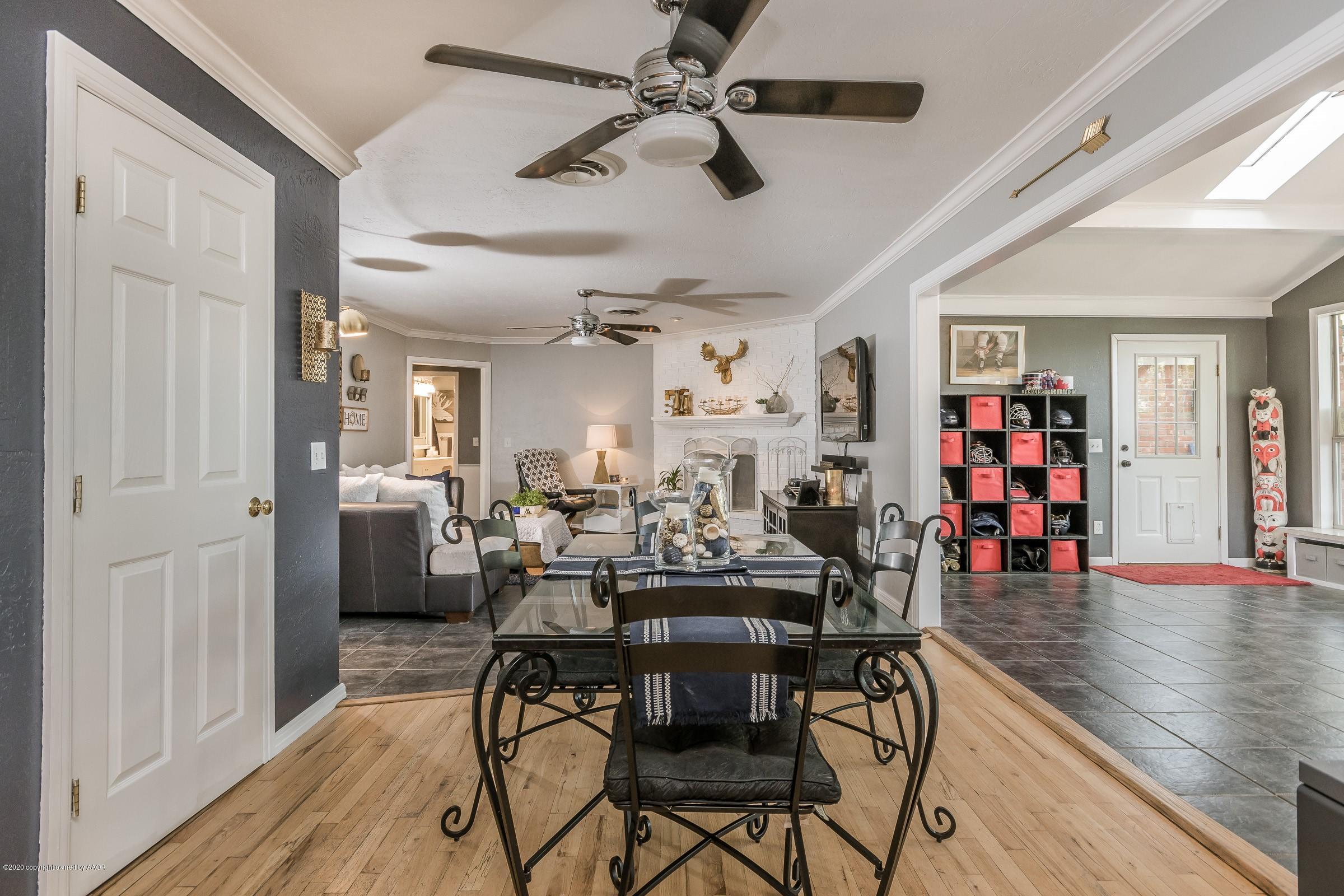 7112 Calumet Road Amarillo, TX 79106 - Photo 8 of 30 a view of a dining room with furniture and wooden floor