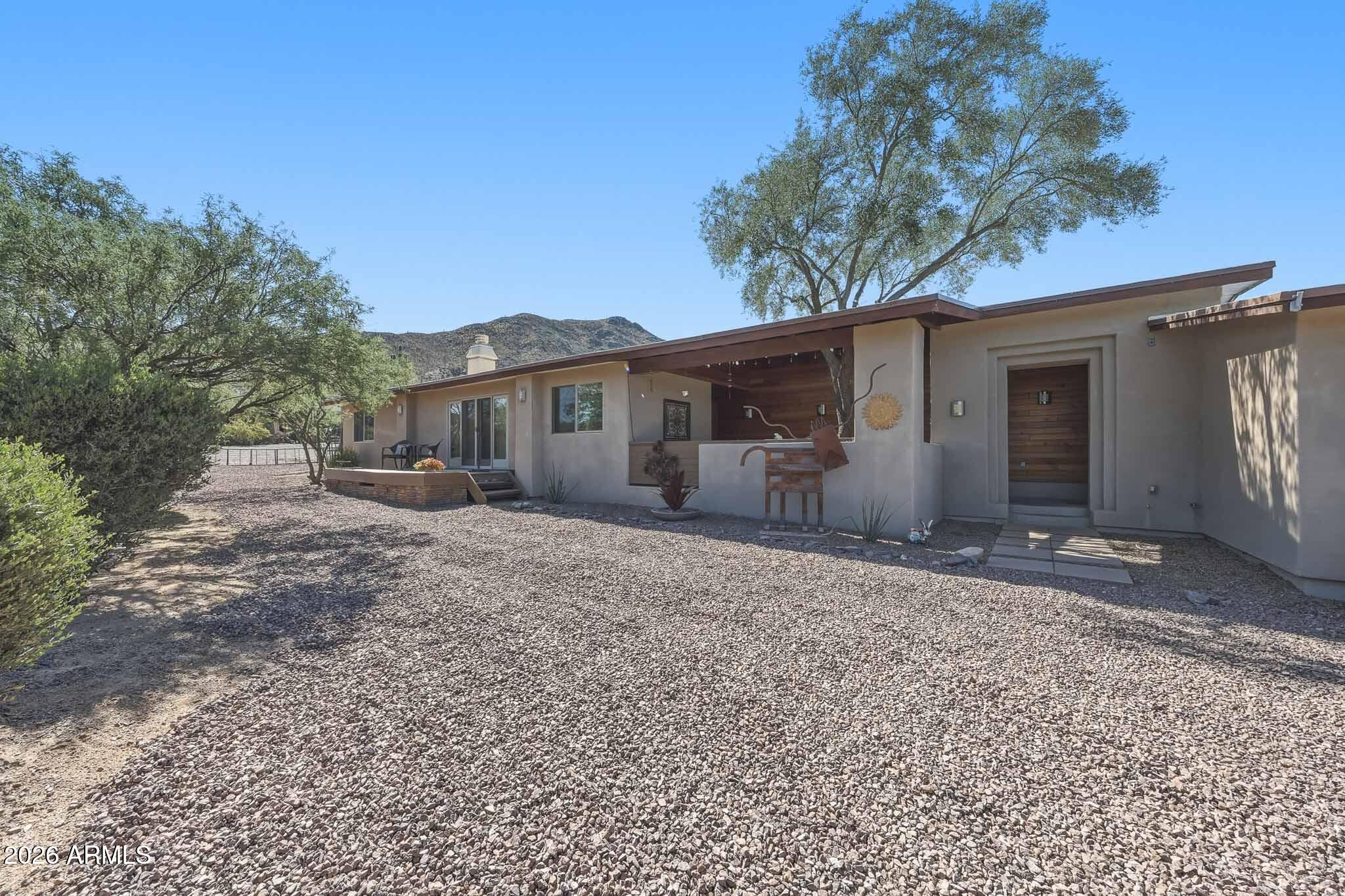 6019 East Blue Ridge Drive Cave Creek, AZ 85331 - Photo 1 of 49 a front view of a house with a yard and garage