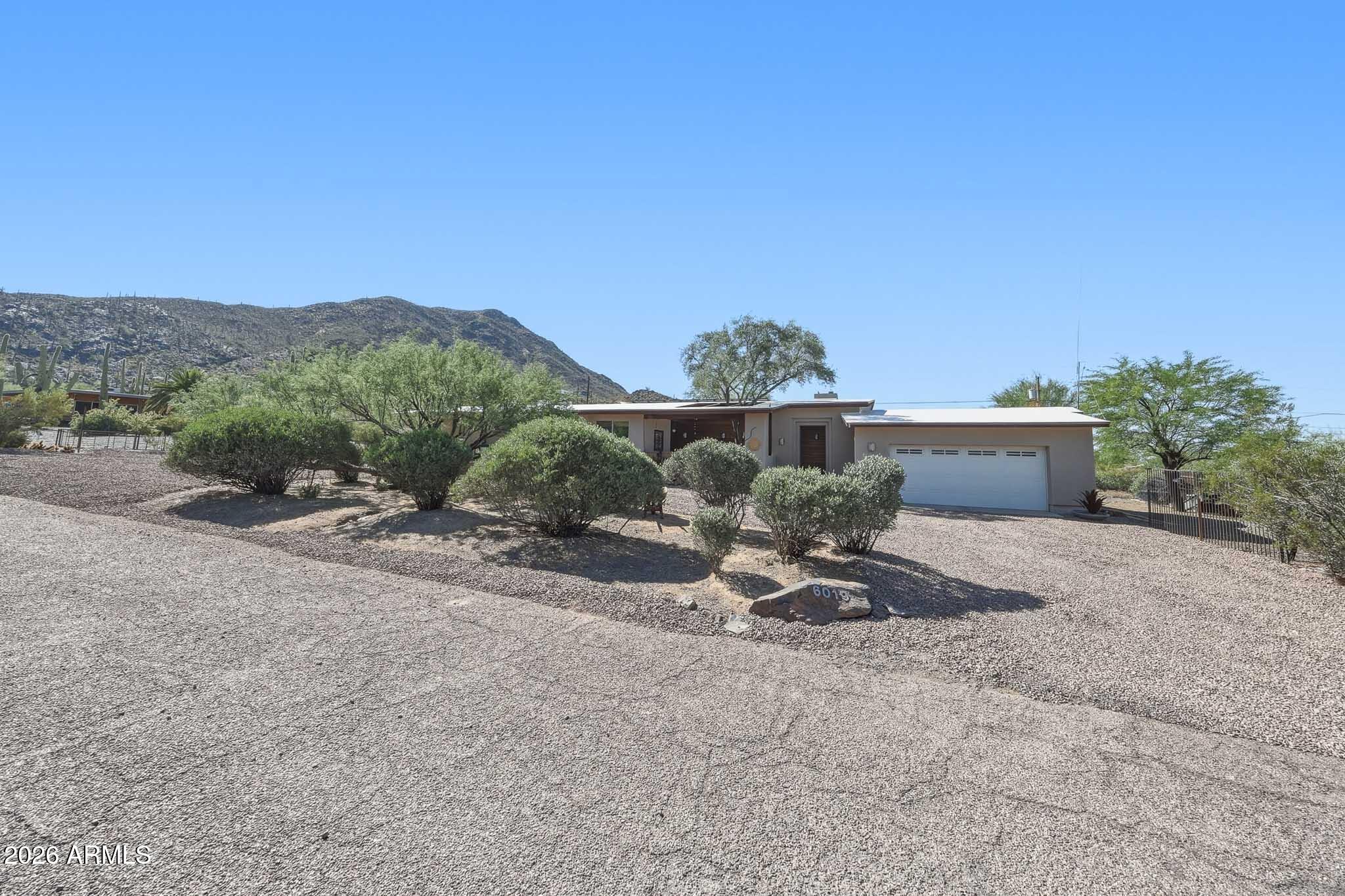 6019 East Blue Ridge Drive Cave Creek, AZ 85331 - Photo 2 of 49 a view of a house with a street