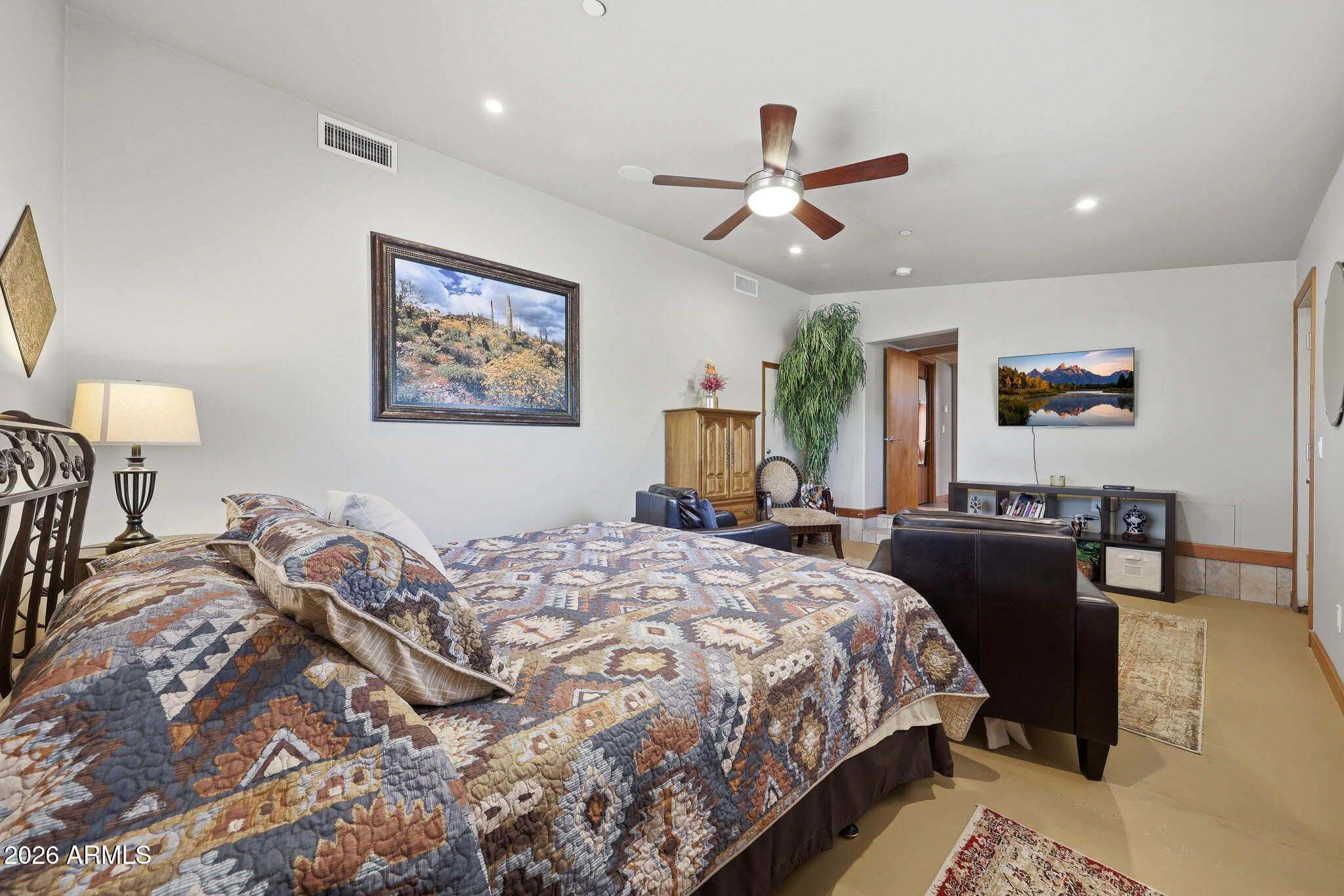 6019 East Blue Ridge Drive Cave Creek, AZ 85331 - Photo 28 of 49 a bedroom with bed and a chandelier