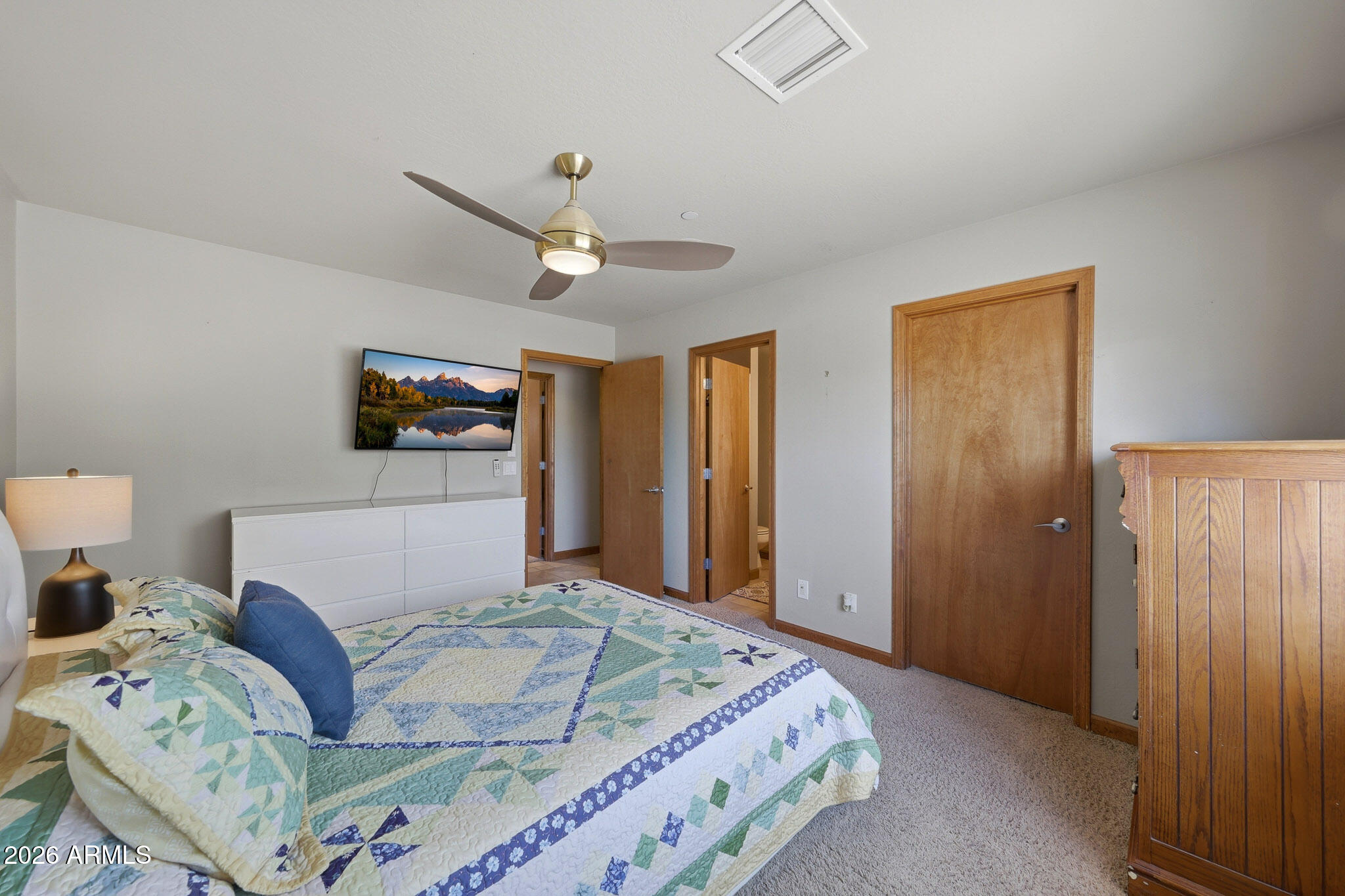 6019 East Blue Ridge Drive Cave Creek, AZ 85331 - Photo 30 of 49 a bedroom with a bed and a flat screen tv