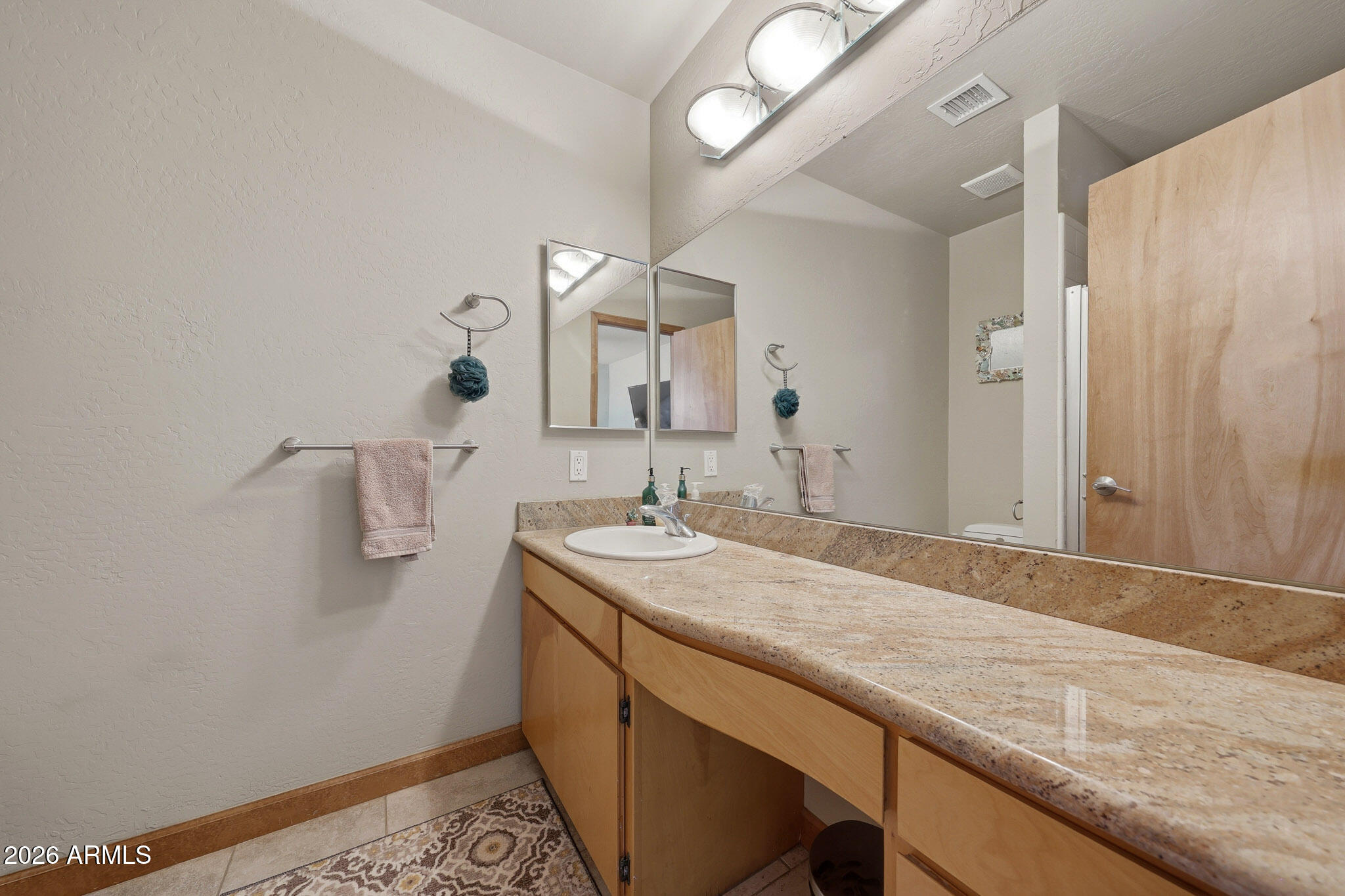 6019 East Blue Ridge Drive Cave Creek, AZ 85331 - Photo 31 of 49 a bathroom with a sink and a mirror