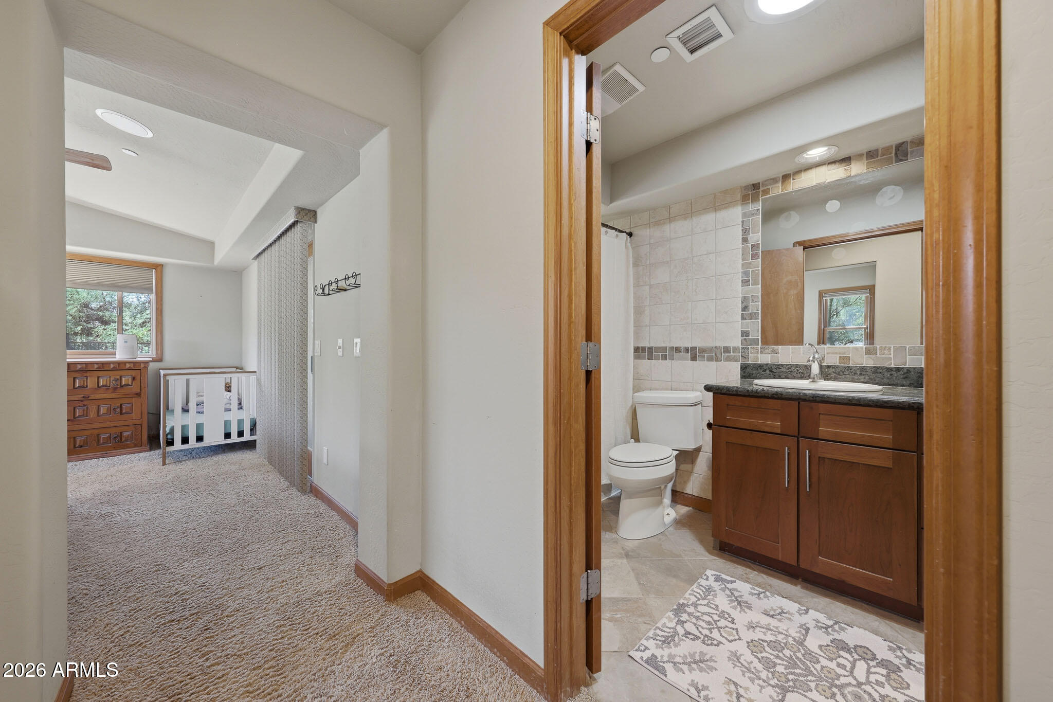 6019 East Blue Ridge Drive Cave Creek, AZ 85331 - Photo 32 of 49 a bathroom with a granite countertop sink mirror and toilet