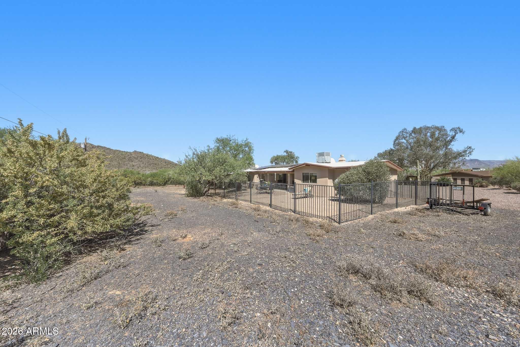 6019 East Blue Ridge Drive Cave Creek, AZ 85331 - Photo 45 of 49 a view of a dirt road with a building in the background