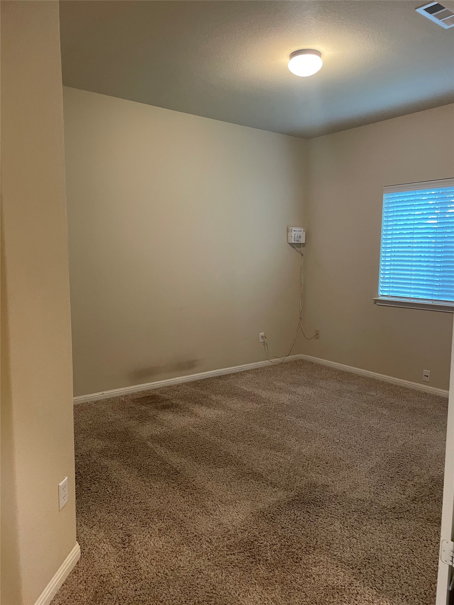 102 Sandy Lyle Cove Round Rock, TX 78664 - Photo 14 of 38 an empty room with a workbench