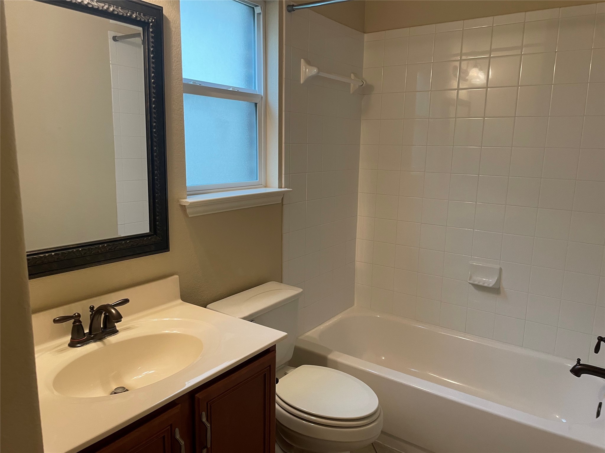 102 Sandy Lyle Cove Round Rock, TX 78664 - Photo 15 of 38 a bathroom with a sink toilet and shower