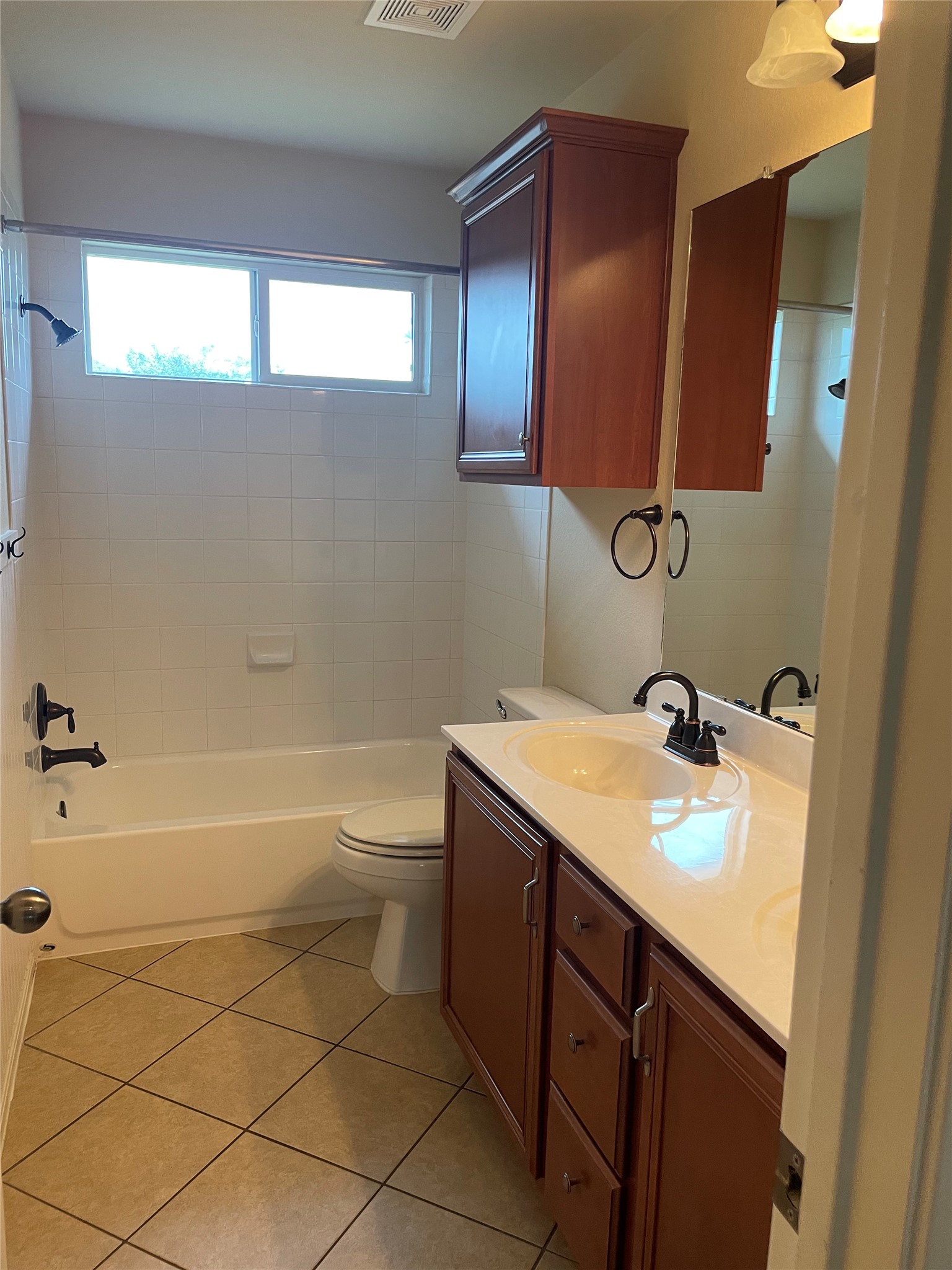 102 Sandy Lyle Cove Round Rock, TX 78664 - Photo 30 of 38 a bathroom with a sink toilet vanity and tub