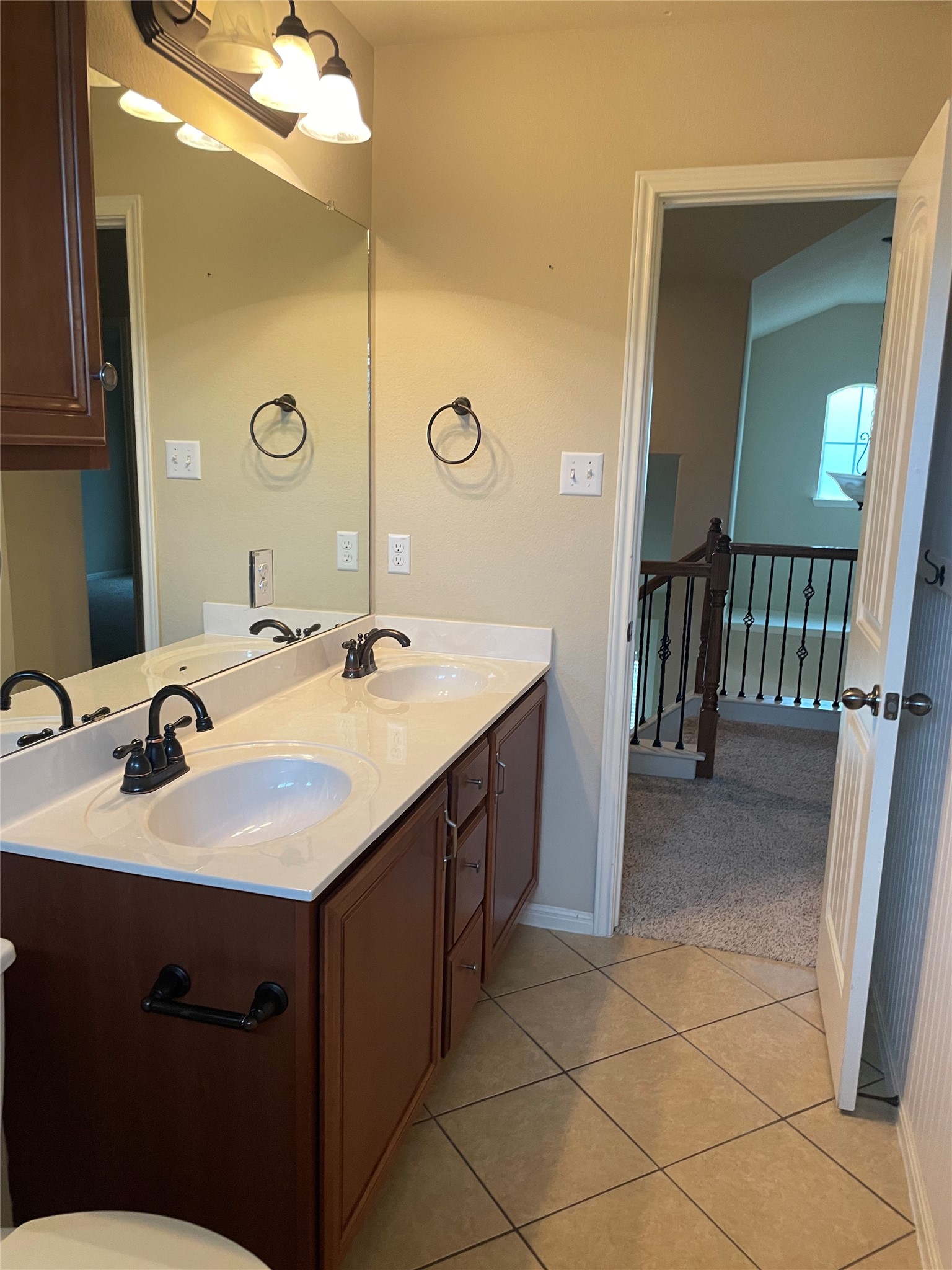 102 Sandy Lyle Cove Round Rock, TX 78664 - Photo 31 of 38 a bathroom with a double vanity sink a and mirror