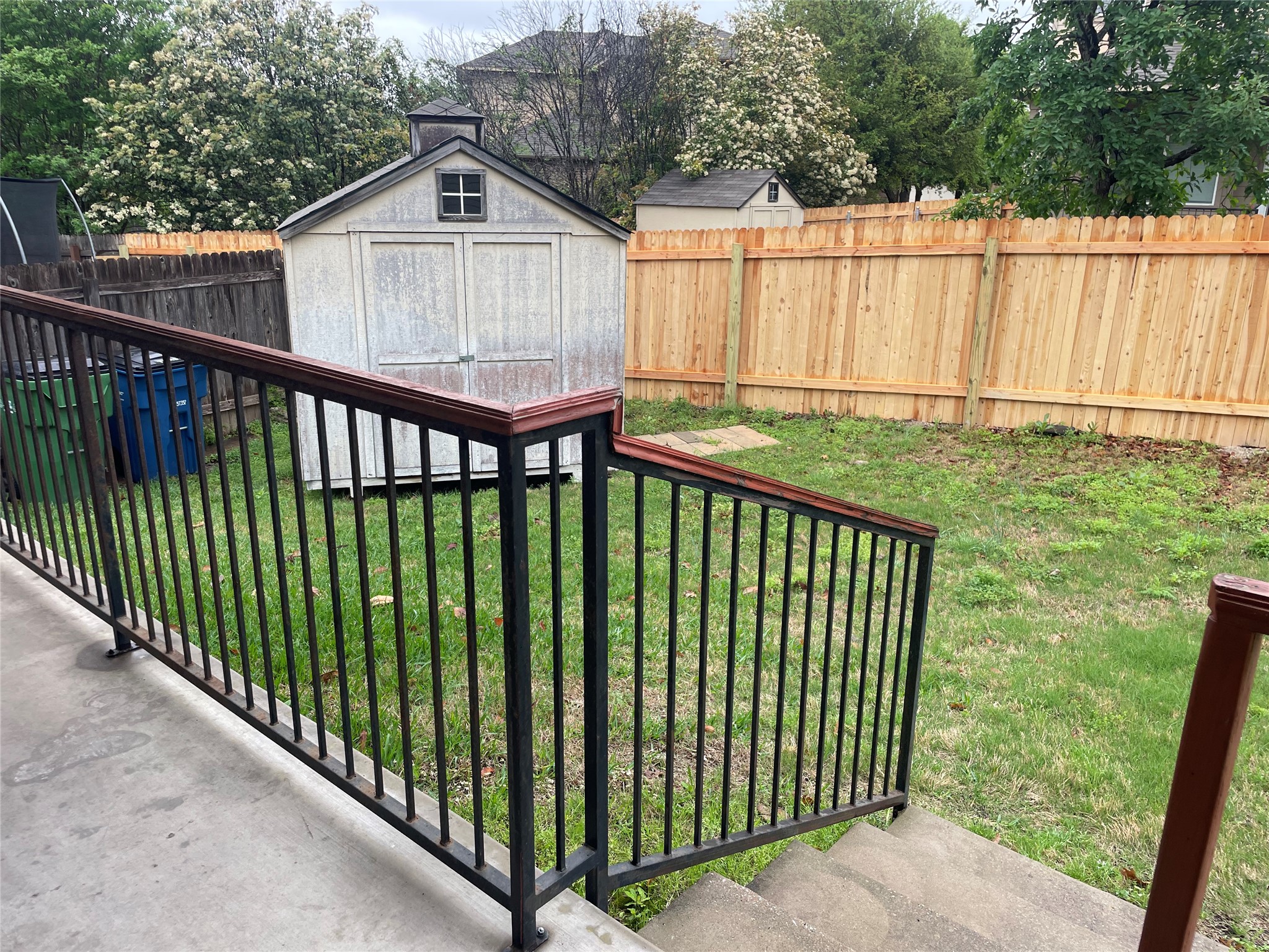 102 Sandy Lyle Cove Round Rock, TX 78664 - Photo 35 of 38 a view of a wooden fence and a yard