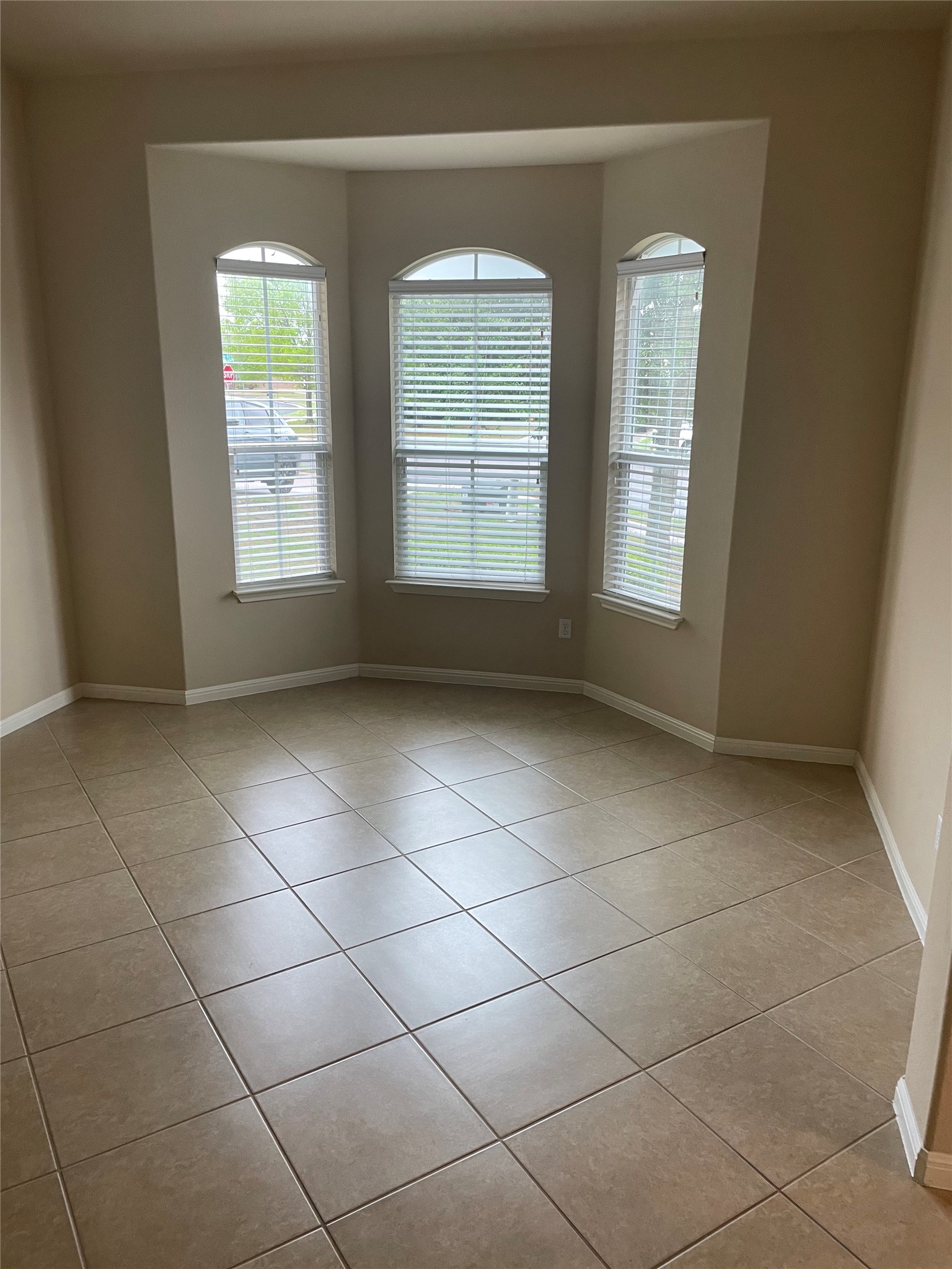 102 Sandy Lyle Cove Round Rock, TX 78664 - Photo 5 of 38 a view of an empty room with a window